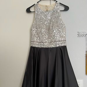 Used once for quince, above the knee dress with sequence and silk like material.